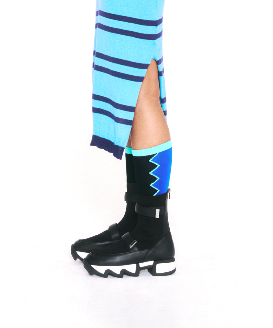 Model wearing DANCING QUEEN Black Multi Knee Socks with iRi VES Black Outline High Top Sneaker