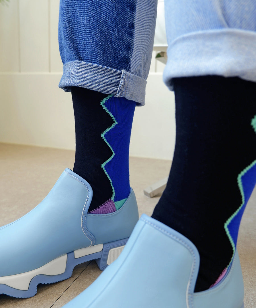 DANCING QUEEN Black Multi Sock worn with WES Dream Blue Low Top Sneaker by a model