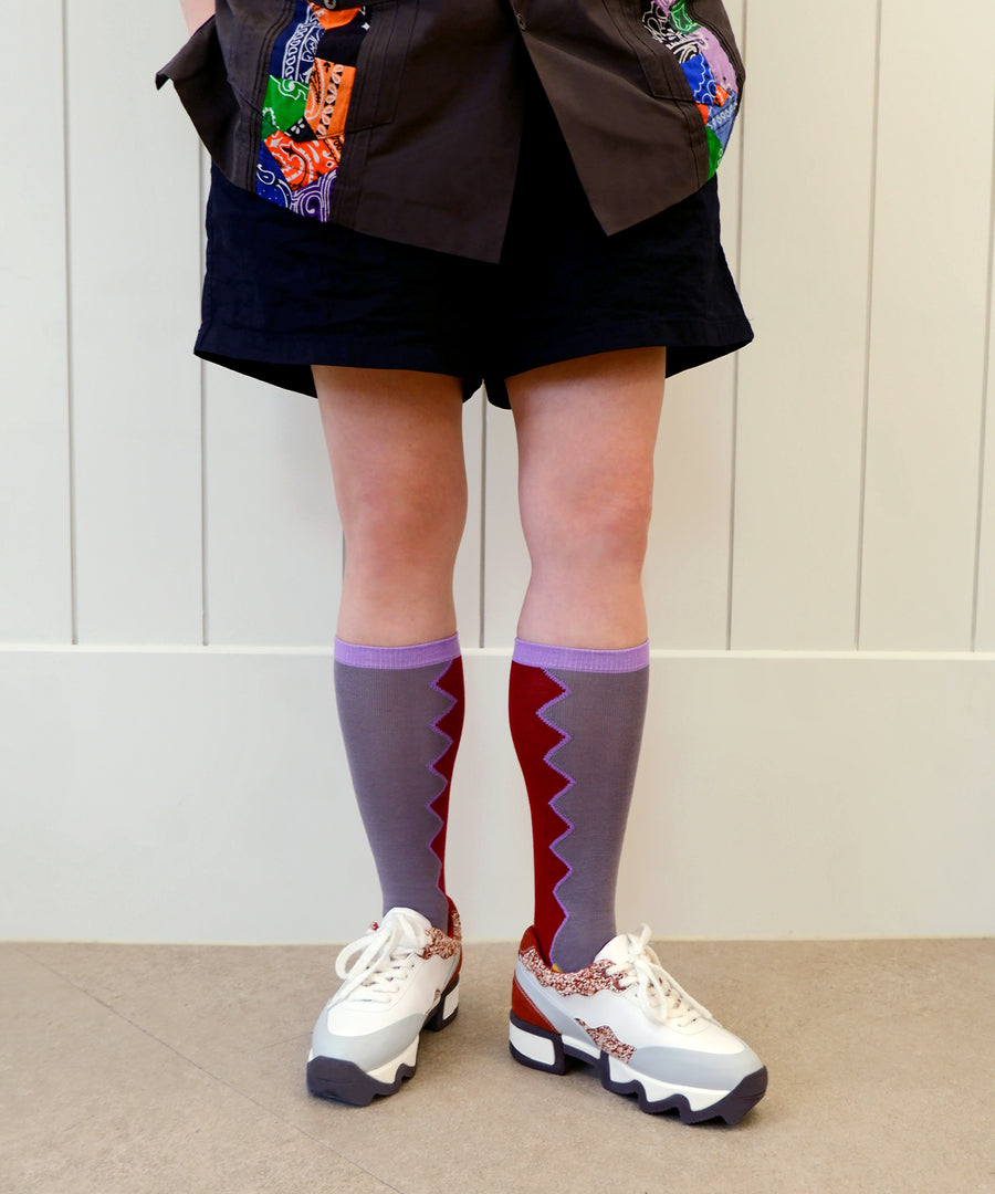 DANCING QUEEN Burgundy Socks worn with RAI Red Brick Low Top Sneaker by a model